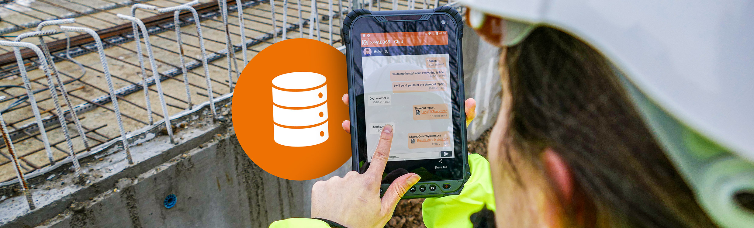 Worker on a construction site looking at tablet. 